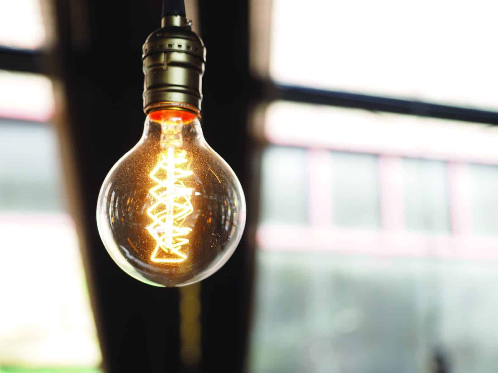 Close up of glowing modern light bulb